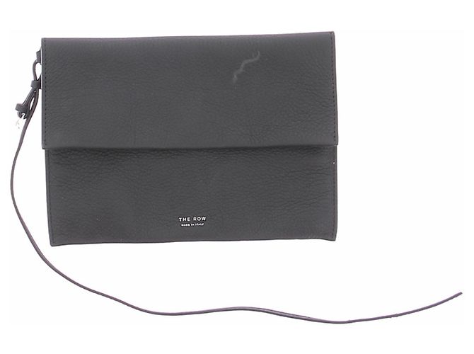 The row Schwarze Leder-Clutch