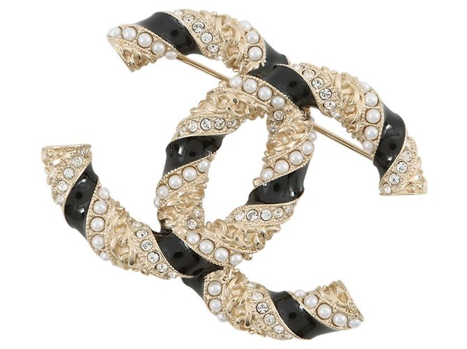 Spilla Chanel in oro e strass D'oro