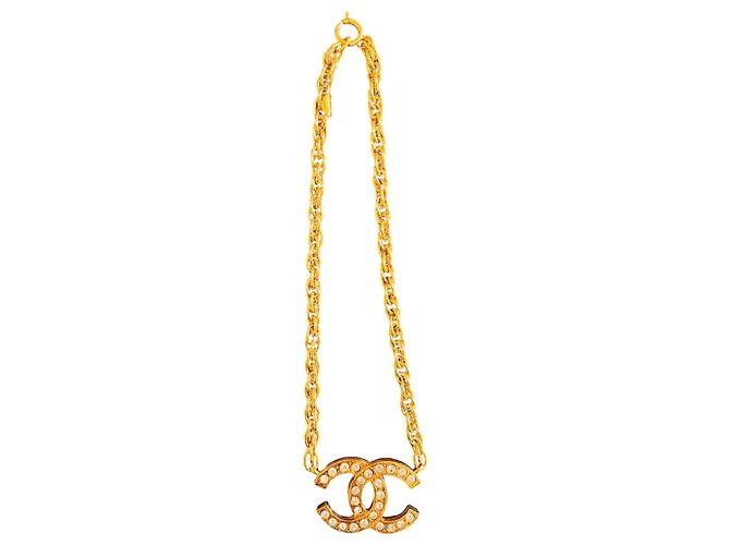 Collier pendentif Chanel CC plaqué or et cristaux