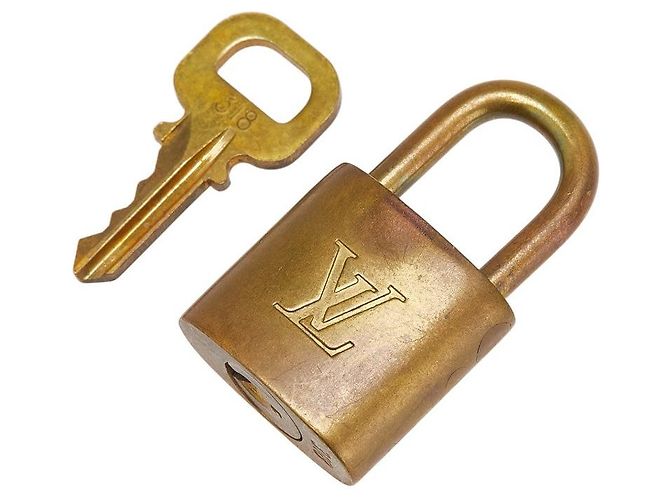 Conjunto de cadeado e chave Louis Vuitton Dourado Metálico