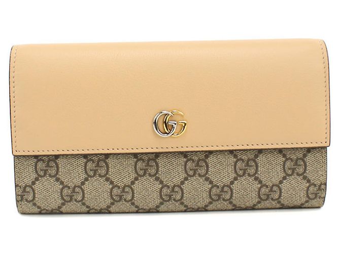 Cartera larga plegable Gucci en beige