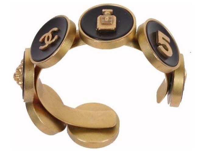 Bracciale rigido Chanel Camélia, N°5 e testa di leone Nero D'oro