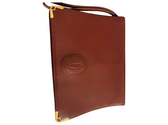 Clutch Cartier de cuero burdeos