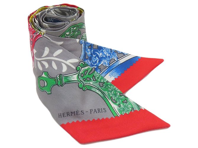 Hermès Lenço de seda Twilly Hermes Marrom