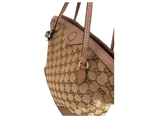 Bolsa de mão Gucci em lona monogram GG e couro Marrom