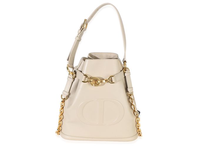 Bolsa bucket medium C'est em couro de bezerro bege com logo CD em relevo Christian Dior