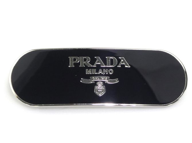 Barrette Prada in metallo nero e argento 