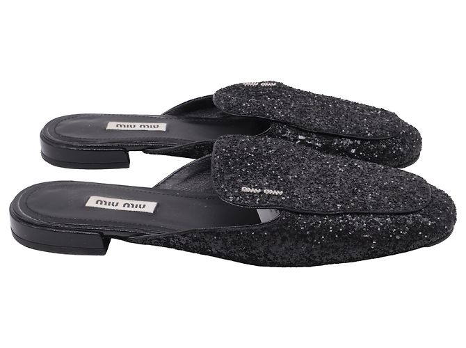 Mules com glitter em couro preto Miu Miu