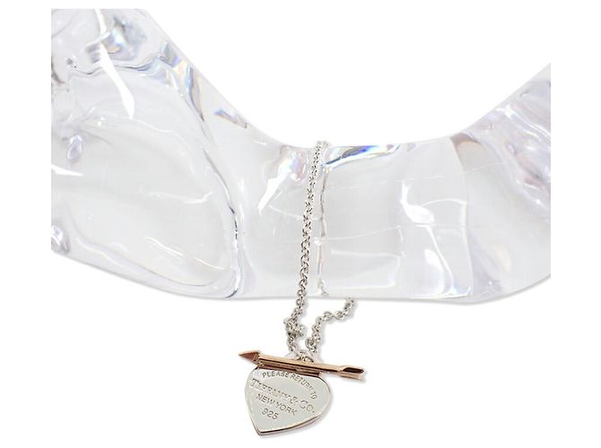 Bracciale con charm in argento sterling e oro giallo 18K di Tiffany & Co.