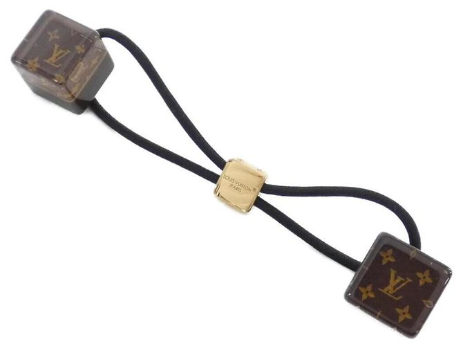 Louis Vuitton Monogram Hair Cube Braun Golden
