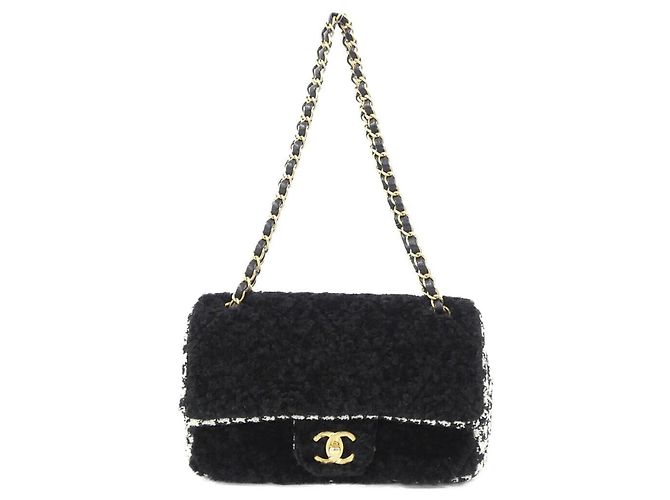 Borsa a tracolla Chanel in tweed nero e pelle