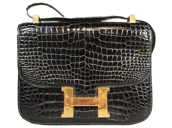 Hermès Constance em couro de jacaré preto