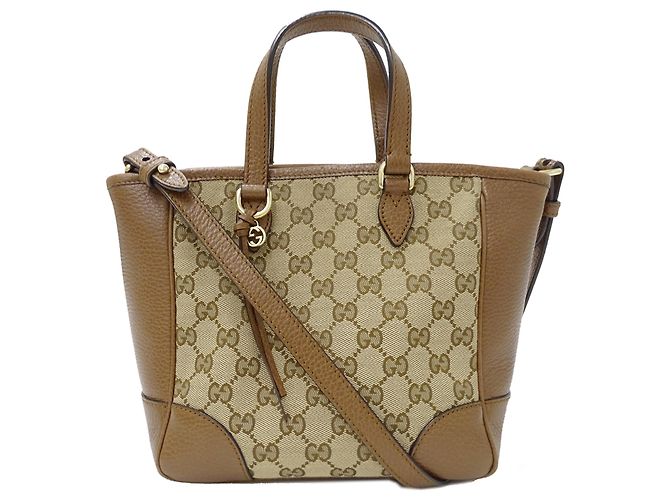 Bolsa Gucci em lona GG bege e marrom