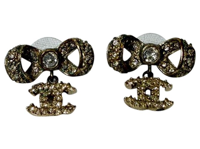 Timeless Orecchini Chanel Crystal CC Bow Drop in metallo dorato Stampa python