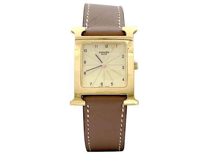Montre Hermès, "Heure H", plaqué or, acier.  