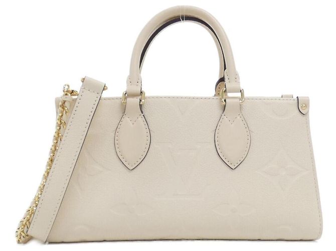 Bolso Louis Vuitton Monogram Empreinte OnTheGo EW Beige