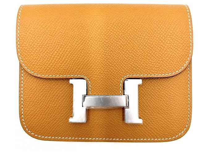 Hermès Portafoglio bi-fold slim Hermes Constance Marrone