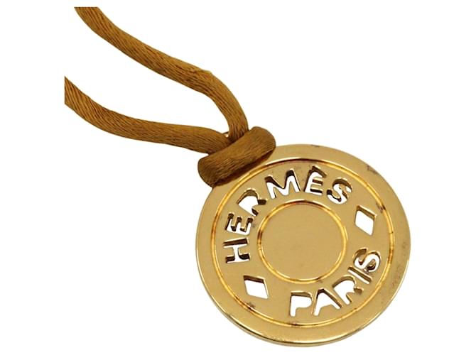 Hermès Collier Hermes Sellier plaqué or et cuir 