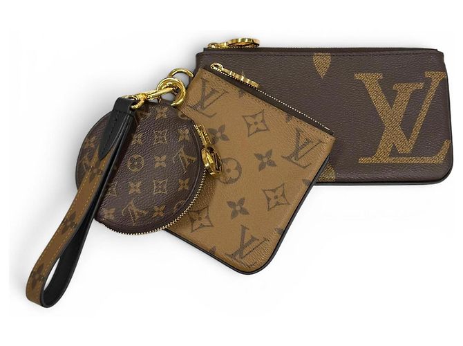 Pochette Trio em couro Monogram Giant Reverse Louis Vuitton Marrom