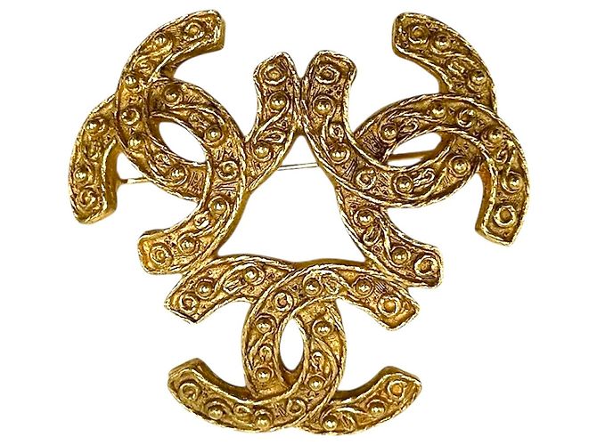Spilla Chanel Vintage placcata oro D'oro