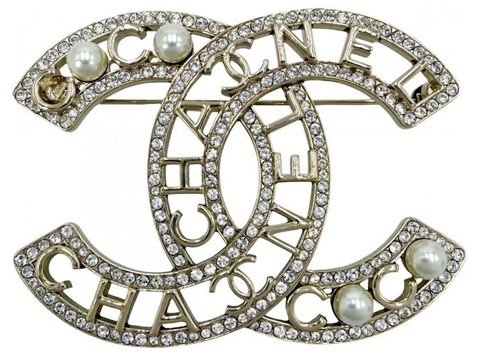 Spilla in argento Chanel con perla finta e strass