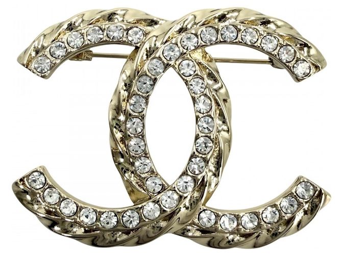 Spilla Chanel in oro e strass D'oro