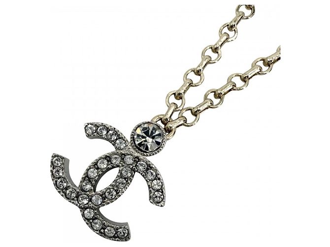 Collier Chanel en or et strass Doré