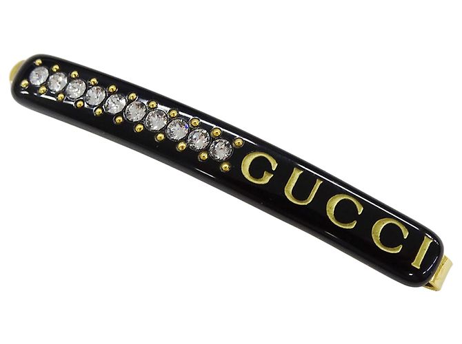 Spilla per capelli in resina nero e oro Gucci D'oro