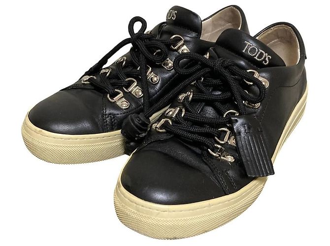 Sneakers con lacci e nappe in pelle Tod's Nero