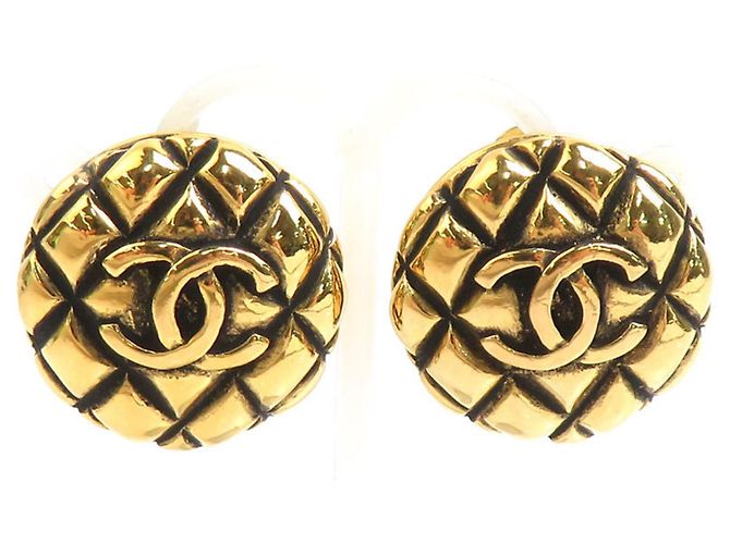 Boucles d'oreilles à clip dorées Chanel