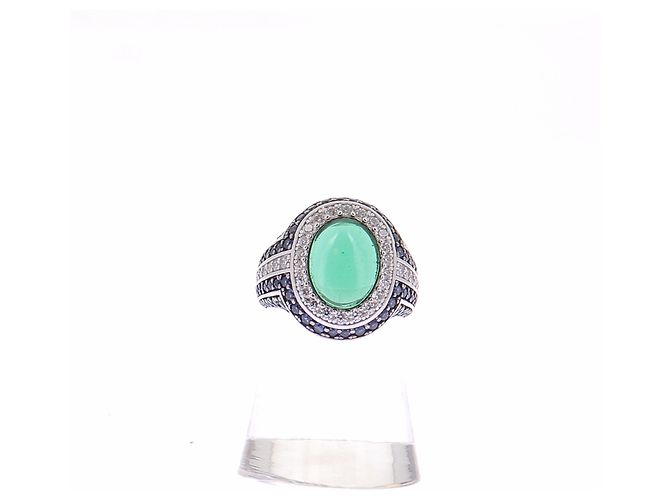 APM Monaco Ring mit blauen Strasssteinen und grünem Stein