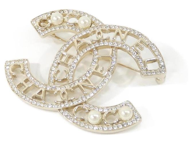 Broche Chanel AB4879 Oro y Blanco Dorado