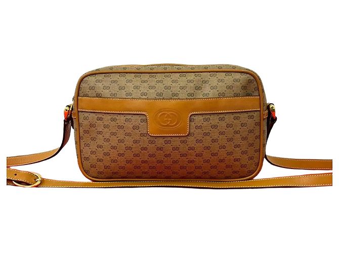Mini bolsa de ombro em couro Micro GG Gucci Marrom