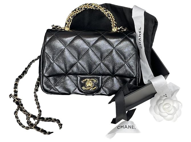 Chanel Mini bolsa com aba e alça preta e dourada Preto