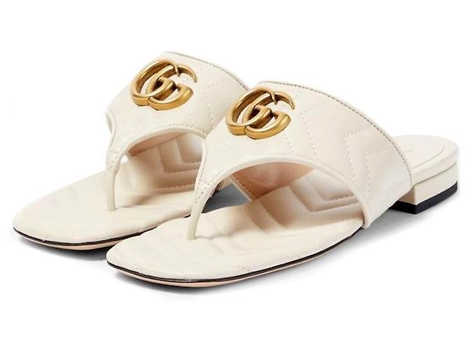Gucci Sandálias rasteiras acolchoadas Marmont para mulher Laranja