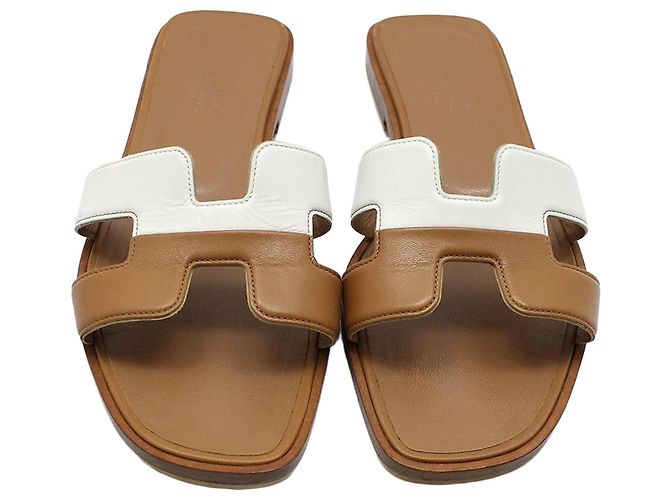 Sandali Oran Hermès in pelle marrone e bianca