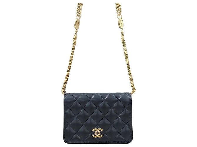 Chanel Mini bolso con solapa y cadena en piel de cordero negro y oro