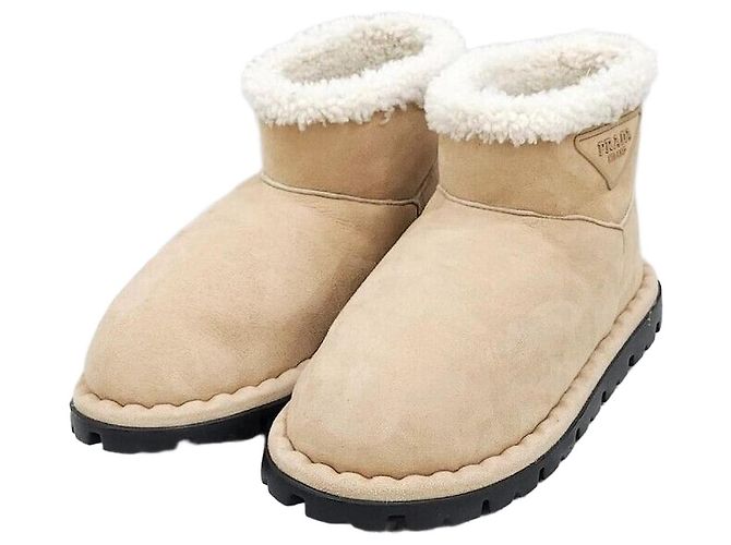 Prada Botas UGG em camurça e shearling Laranja