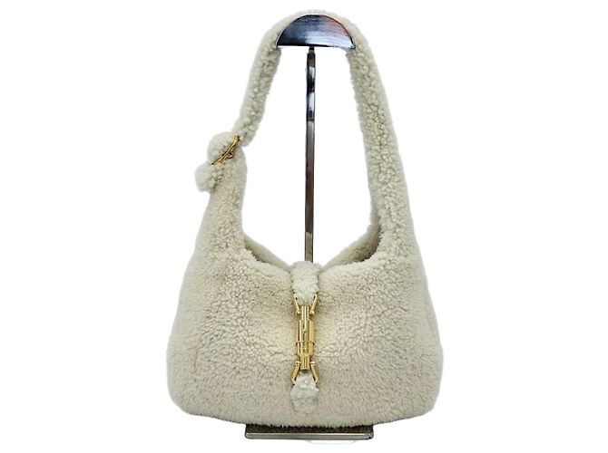 Gucci Bolsa de ombro Jackie Small em shearling meia-lua Multicor