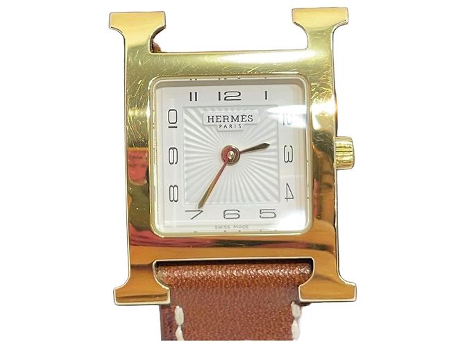 Hermès Relógio feminino de couro com banho de ouro e pulseira dupla Dourado
