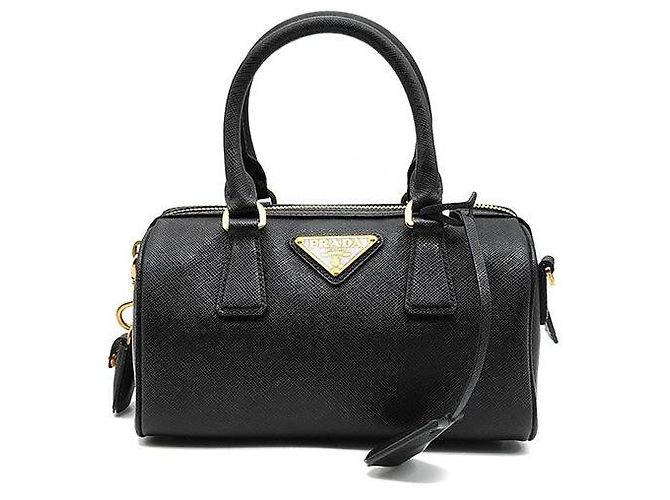 Prada Mini bolso bandolera con asa superior en Saffiano Negro