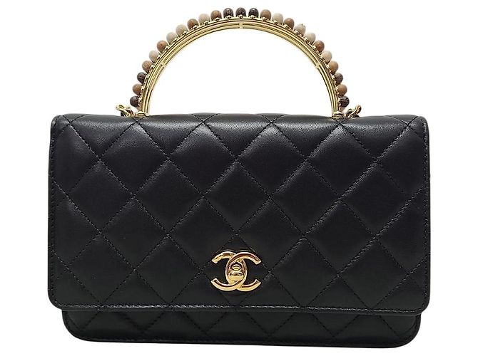 Chanel Mini bolsa transversal de pele de cordeiro com alça de mão e corrente de pérolas preto