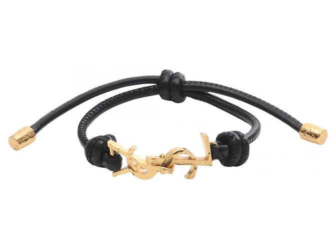 Yves Saint Laurent Pulseira Cassandra em couro Saint Laurent Paris Dourado Metálico