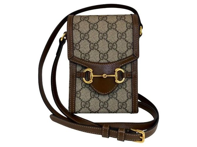 Horsebit 1955 Gucci Bolsa Transversal Horsebit GG Mini Canvas Marrom