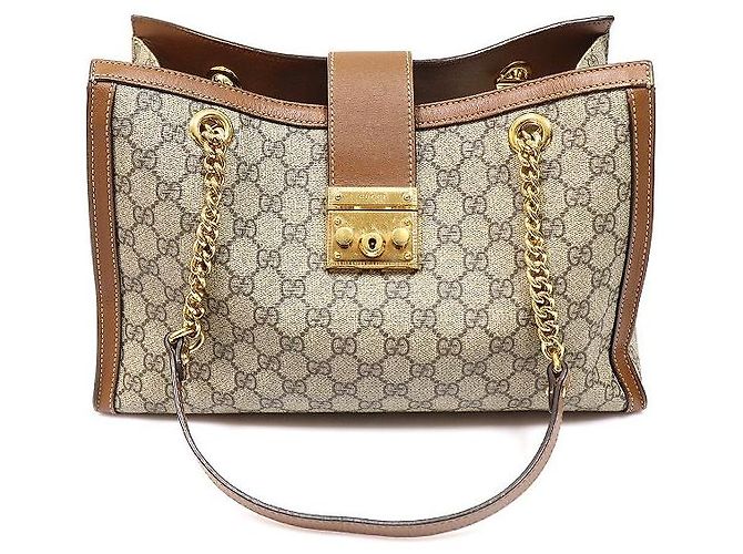 Gucci Bolsa de ombro GG Medium em couro e lona marrom