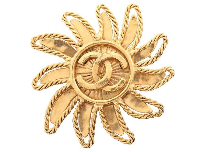 Broche fleur emblème Coco de Chanel Doré