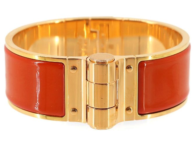 Bracciale Charm Hermès in Oro e Rouge Vif Rosso D'oro