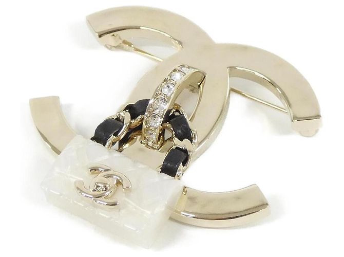 Spilla Chanel ABA011 in pelle nera bianca e oro Nero Bianco D'oro