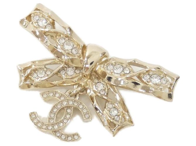 Spilla Chanel trasparente e oro D'oro 