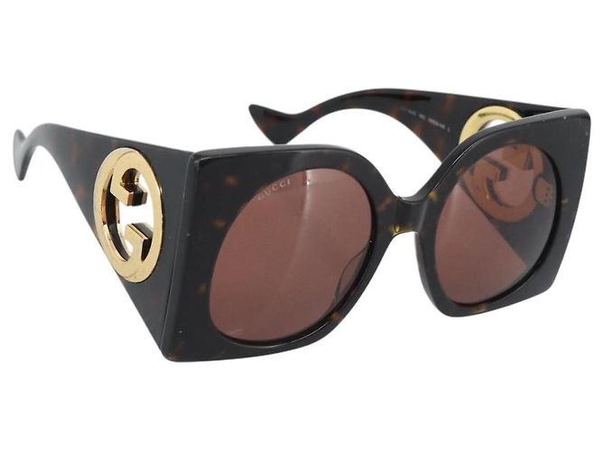 Gafas de sol GUCCI de plástico negro y dorado Auth bs36341